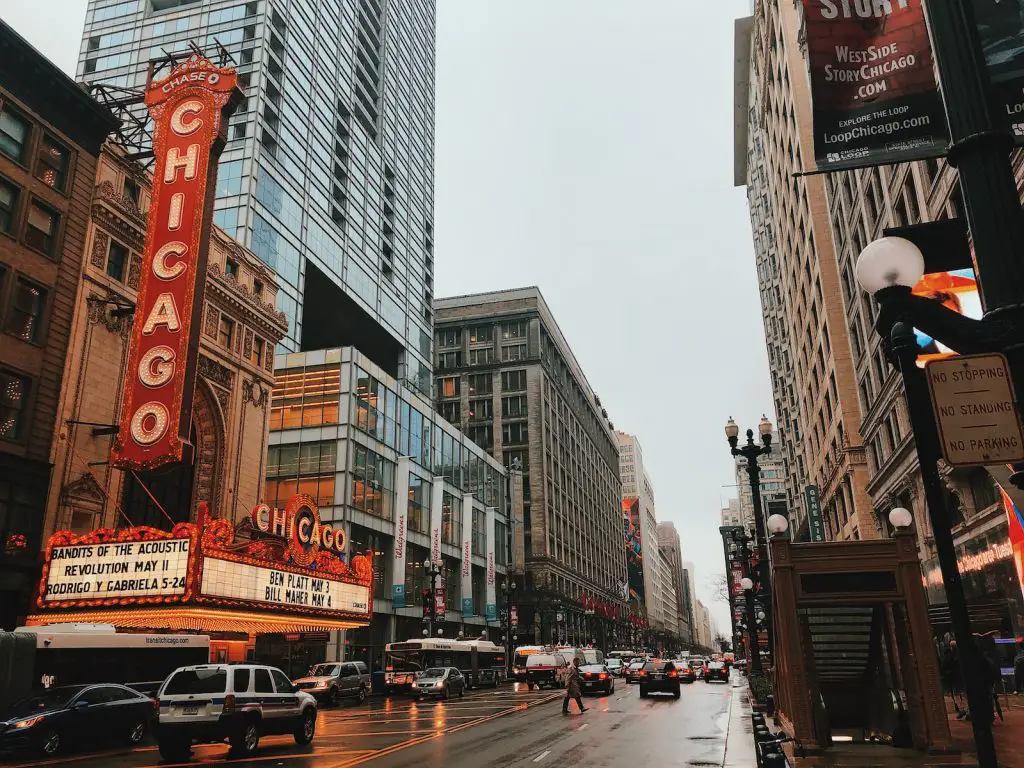 different vehicles on road near Chicago city buildings