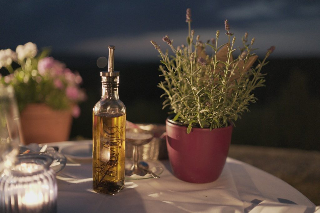 Olive oil besides Lavender plant