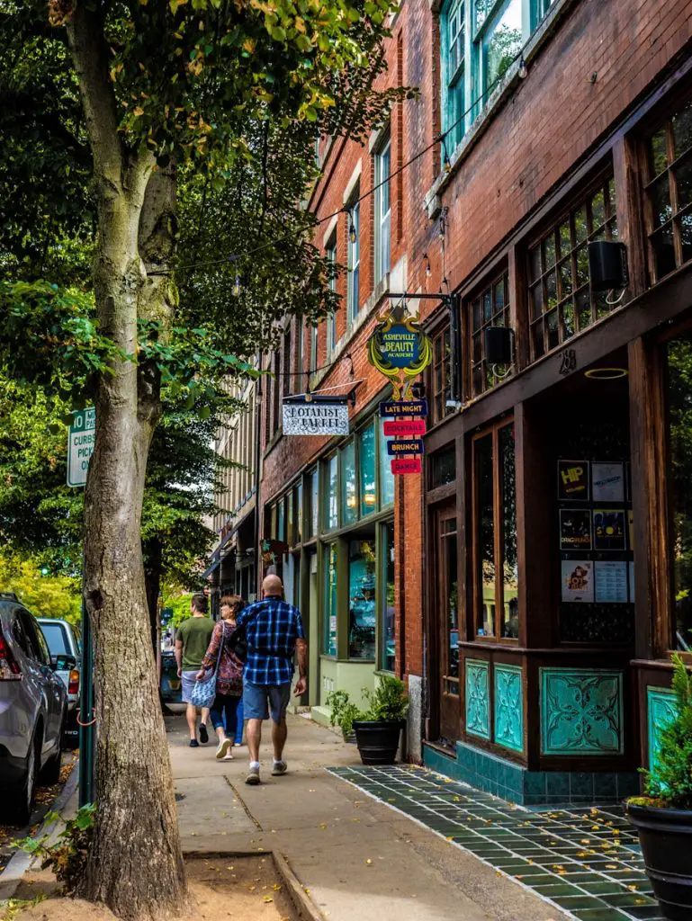 people walking on a sidewalk